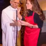 gandhi and an artist standing together