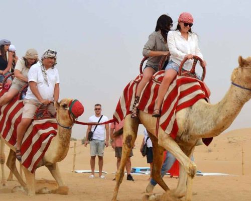 camel riding in desert dubai