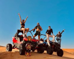 a group photo of 2 dune bugges