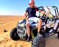 a man with falcon and polaris buggy